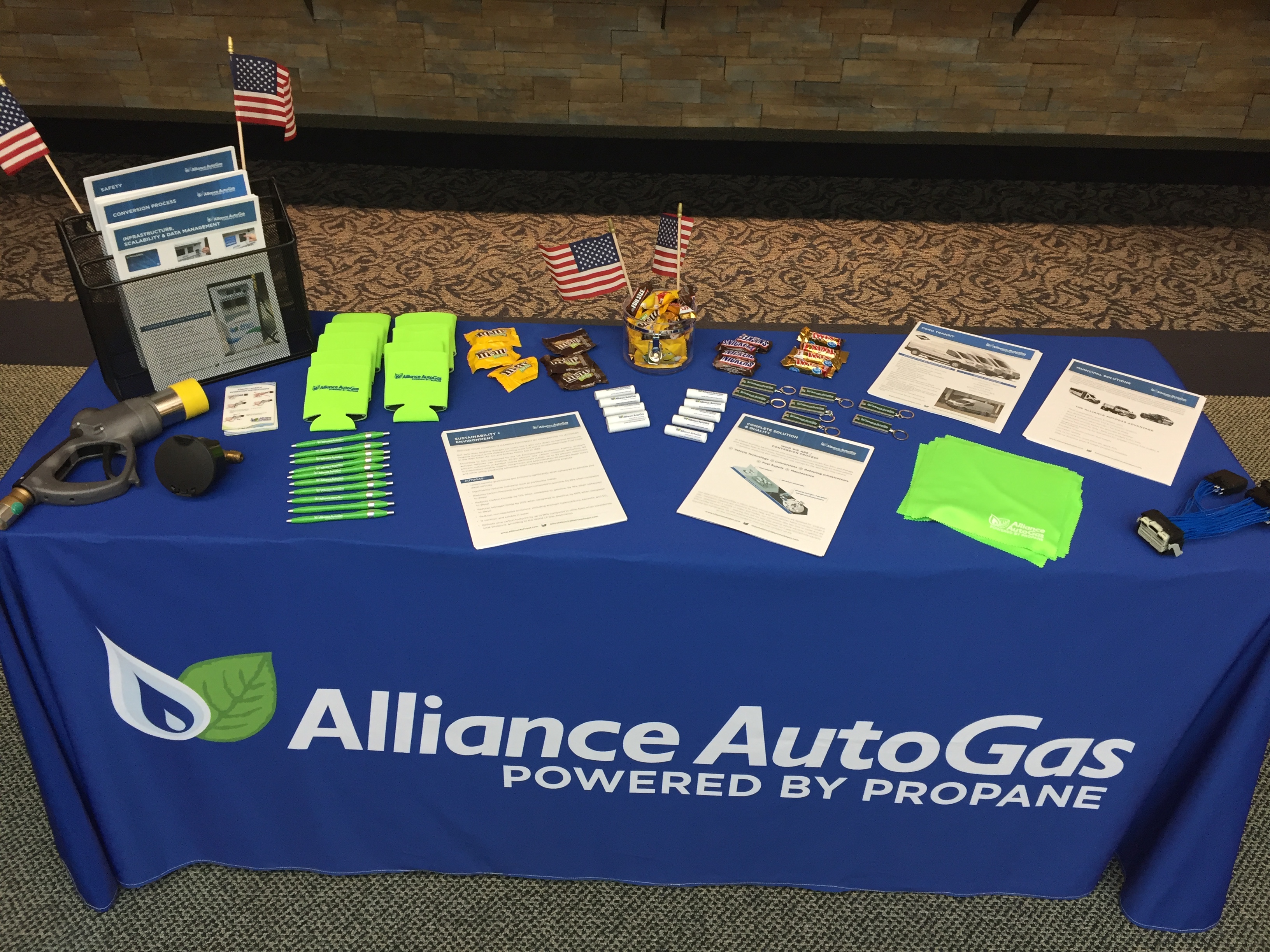 Alliance AutoGas Swag Table Set Up At Expo - Blue Table Cloth with Company Logo